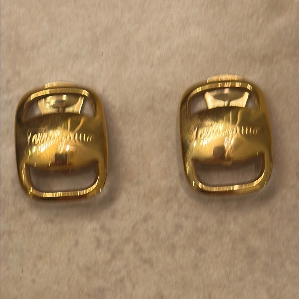Gold clip on earrings with Ferragamo signatures